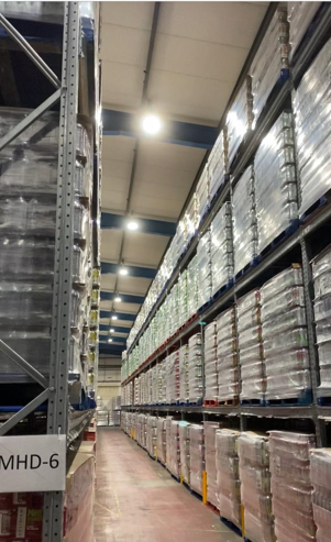 High-bay warehouse lighting over racking, industrial LED installation Liverpool