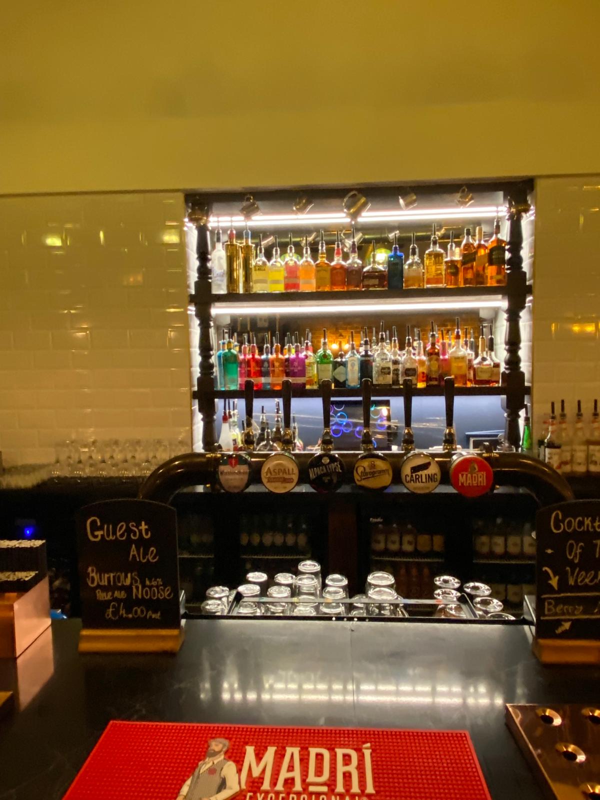 Backlit spirit shelving and bar lighting installation, commercial project