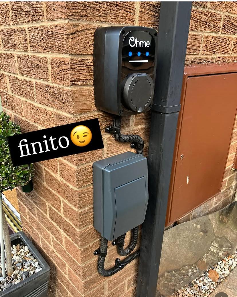 Ohme home EV charger and isolator installed on external wall, Liverpool